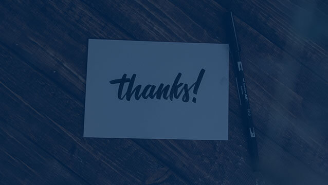 A handwritten note on a table that says "thanks!"